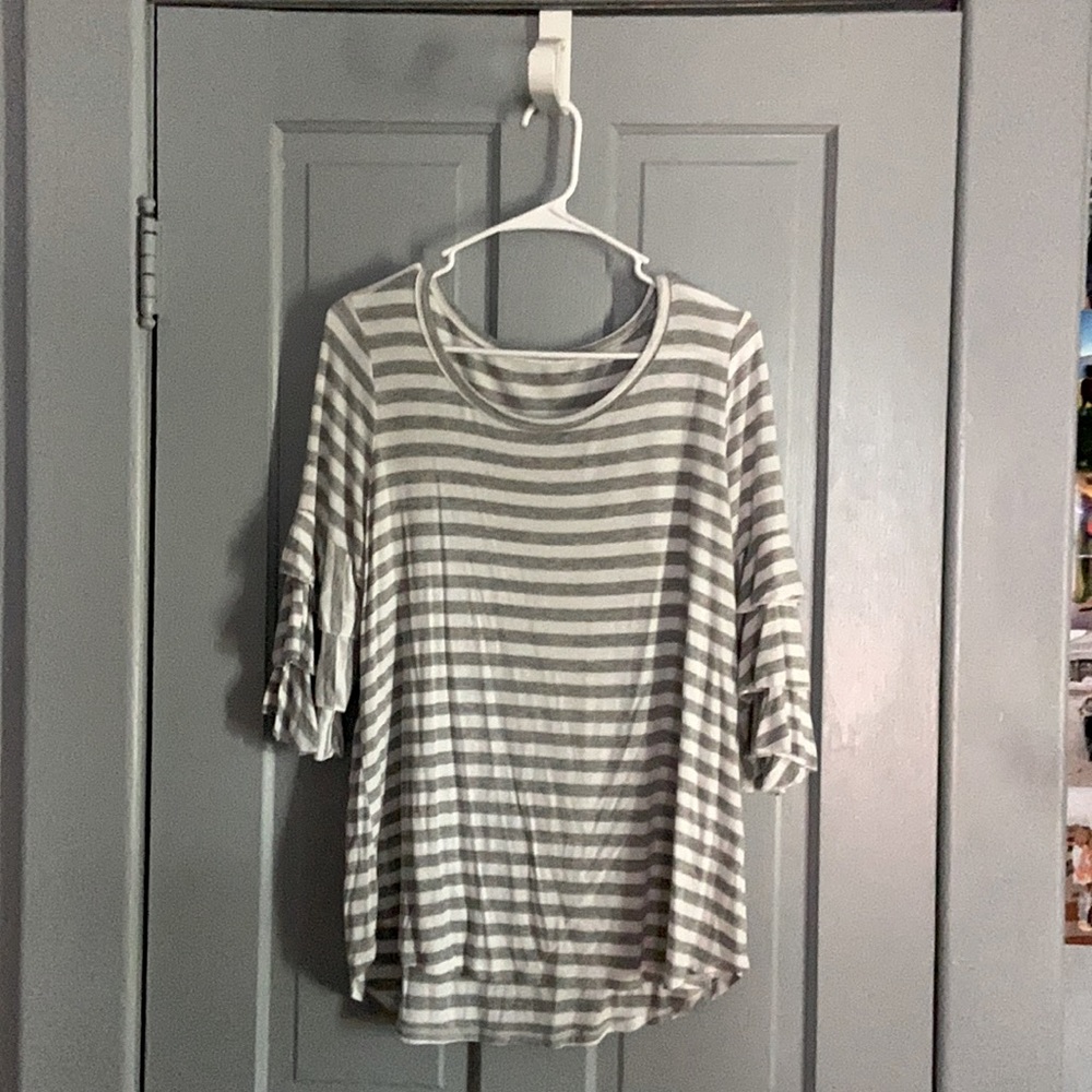 gray and white shirt with ruffled sleeves